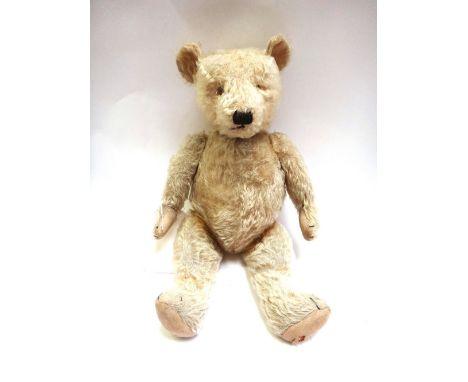 A Steiff style teddy bear c.1930, blonde hair, handstitched snout, hump back and jointed limbs, 54cm.