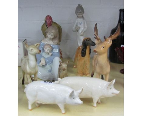 A Beswick woodpecker, number 1218, a Beswick stag, deer and fawn, two Beswick pigs 'Ch Wallboy 53' and 'Ch WallQueen 40', a B