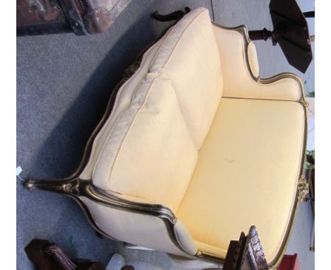 A Louis XV style gilt framed three piece suite to include a sofa, 140cm wide, and a pair of armchairs each with sea scroll cr
