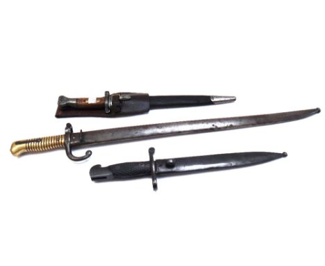 Eight bayonets, including; a French 19th century bayonet with shaped steel blade (57.5cm) and ribbed brass handle in a metal 