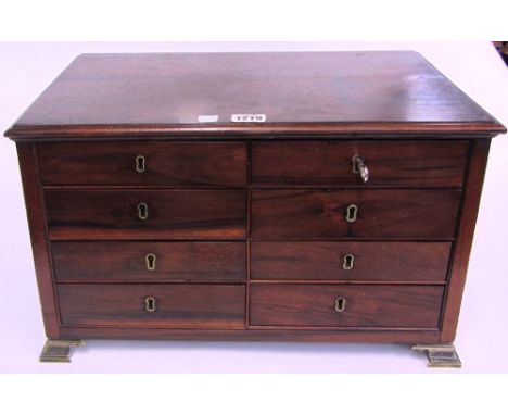 A 19th century miniature Goncalo Alves bank of eight short drawers on pointed brass bracket feet, 44cm wide.