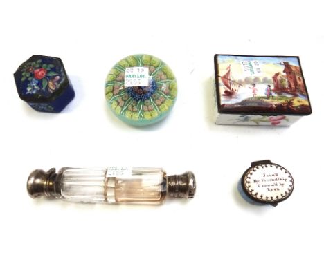 A double ended glass scent bottle of faceted form, 12.5cm, three enamel patch boxes, and a glass paperweight with Millefiori 
