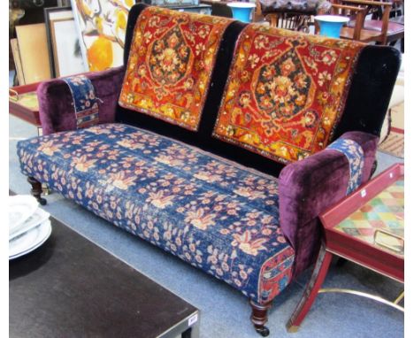 A 19th century French sofa with carpet upholstery on turned walnut supports, 150cm wide. 