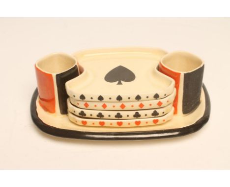 A ROYAL DOULTON POTTERY ART DECO BRIDGE SET of rounded oblong form printed in underglaze black and overpainted in orange with