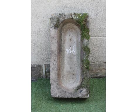 A SANDSTONE TROUGH of rough hewn oblong form, well cut, 34 1/2" x 16" x 8 1/2" (Est. plus 21% premium inc. VAT)