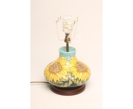 A MOORCROFT POTTERY LAMP BASE, modern, of squat baluster form tubelined and painted in yellow, brown, green and blue with thr