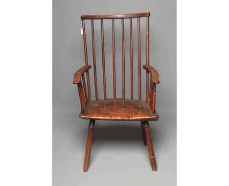 A PRIMITIVE ASH AND ELM STICK BACK WINDSOR ARMCHAIR, 18th century, possibly Welsh, with dished curved top rail, shaped arms w