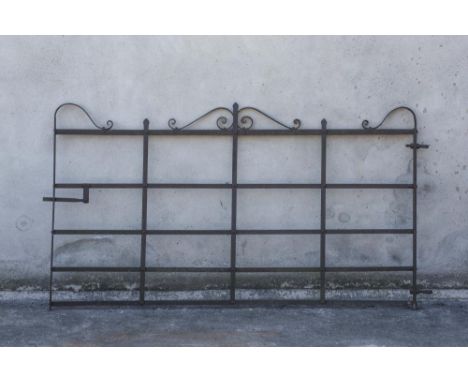 A WROUGHT IRON FIVE BAR GATE with scrolled surmount, c.1900, 100" wide (including hinge housing), 54" high (Est. plus 21% pre