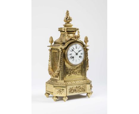 A GILDED BRASS CASED MANTEL CLOCK by Roger Paris, with spring driven bell striking twin barrel movement inscribed 3970, the 3