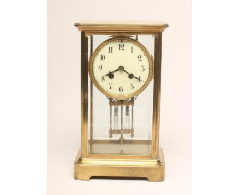 A FRENCH BRASS CASED FOUR GLASS MANTEL CLOCK, c.1900, the twin barrel movement with anchor escapement striking on a gong, twi