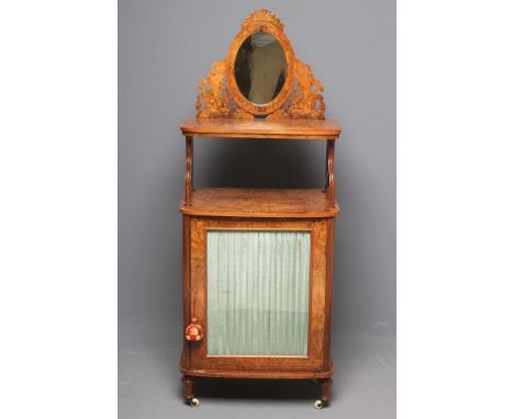 A VICTORIAN BURR WALNUT MUSIC CABINET of bowed form, crossbanded with boxwood stringing and inlaid with foliate scrolls, the 