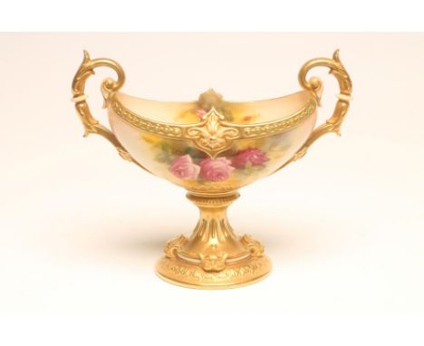 A ROYAL WORCESTER CHINA PEDESTAL BOWL, 1928, of boat form with two leaf sheathed scroll handles on a fluted socle and circula