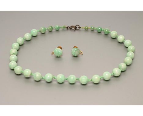 A SINGLE STRING OF GRADUATED JADE BEADS, 15" long, together with a pair of 9ct gold screw earrings set with a flower carved j