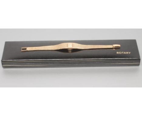 A LADY'S 9CT GOLD ROTARY WRISTWATCH, the gilt dial with applied metal batons, the twenty one jewel movement in an oblong case