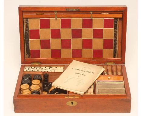 A VICTORIAN MAHOGANY GAMES COMPENDIUM, the plain oblong box with vacant inset brass panel to the cover, hinged and opening to