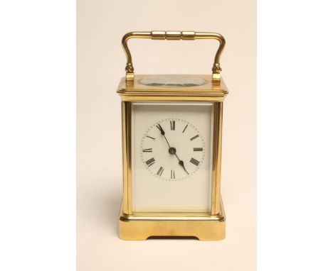 A BRASS CASED CARRIAGE CLOCK, late 19th century, the gong striking movement regulated by a platform escapement, white enamel 