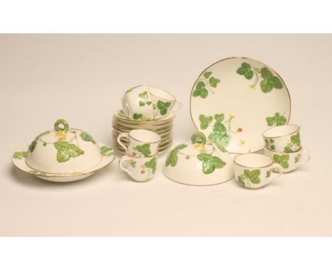 A VICTORIAN STAFFORDSHIRE PORCELAIN AFTERNOON TEA PART SERVICE, moulded in relief with wild strawberries, comprising muffin d