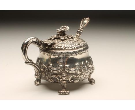 A GEORGE III SILVER MUSTARD POT, maker's mark SW, London 1816, of squat baluster form with acanthus leaf sheathed double "C" 