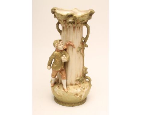 A ROYAL DUX BISQUE PORCELAIN VASE, early 20th century, modelled as a young boy wearing winter clothes throwing snowballs, sta