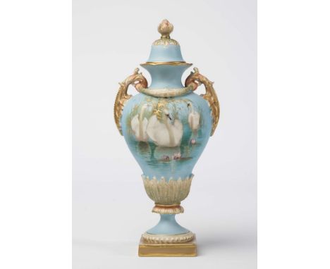 A ROYAL WORCESTER CHINA VASE AND COVER, 1900, of baluster form with everted rim, two leaf moulded handles tied by a swag, on 