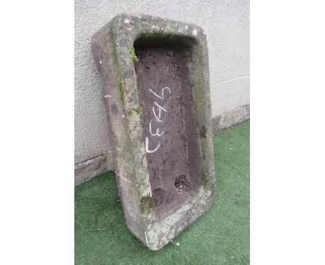 A SANDSTONE TROUGH of rough hewn rounded oblong form, well cut, 36" x 18 1/2" x 8" (Est. plus 21% premium inc. VAT)  (Illustr