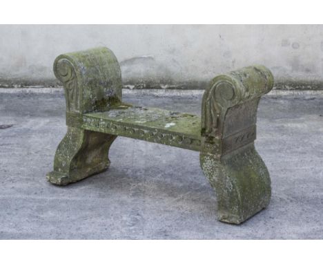 A VICTORIAN SANDSTONE BENCH, the oblong seat with Vitruvian scroll edge banding, raised scroll and leaf carved ends, one insc