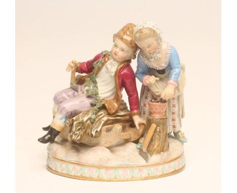 A MEISSEN PORCELAIN FIGURE GROUP allegorical of Winter, late 19th century, modelled as a young boy wearing a fur hat, claret 