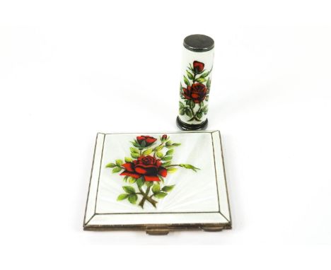 A silver and enamel powder compact and lipstick case, with engine turned decoration, the lid and cylinder basse taille sunbur