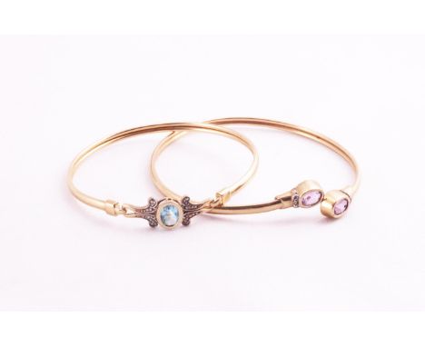 A hallmarked 9ct gold amethyst and illusion set diamond crossover bangle; A hallmarked 9ct gold blue topaz bangle. Gross weig