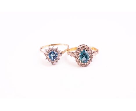 A collection of two dress rings to include: A hallmarked 18ct gold blue zircon and diamond cluster ring, size J; A hallmarked