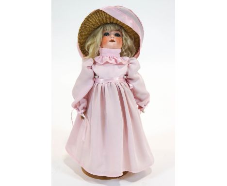 A German (William Goebel) bisque headed doll, with jointed composition body, the reverse of the head impressed Wg/120/2/Germa