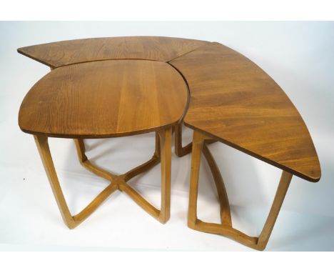 A set of Ercol sectional light elm occasional tables, comprising a central square section tabl flanked by four crescent shape