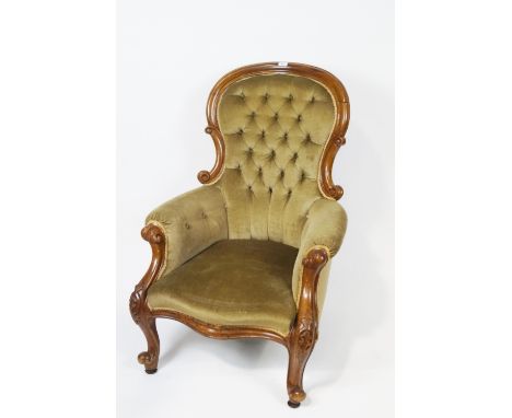 A Victorian mahogany show frame armchair with button back on carved cabriole legs, 104cm high (overall) x 74cm wide