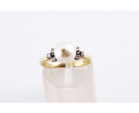 A yellow metal ring principally set with a 7.5mm pearl and finished with six single cut diamonds. No hallmark - Stamped 14K I