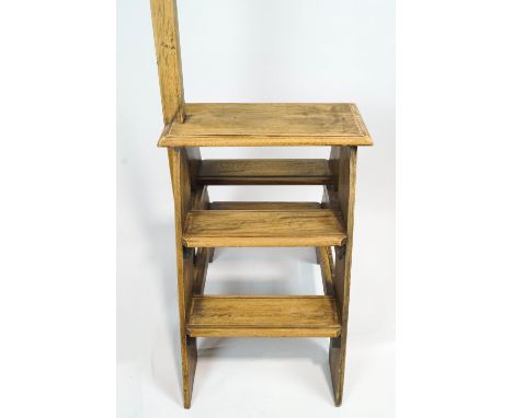 A set of stripped oak library steps, of A-frame construction, with turned upright handrail, 138cm high x 49.5cm wide x 70cm d