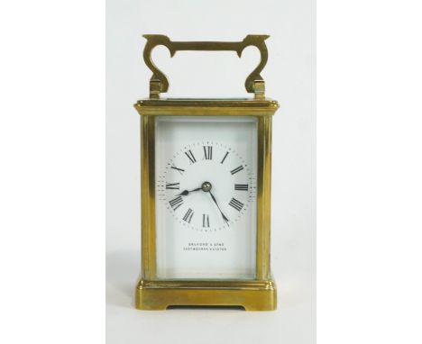 A brass carriage clock, the enamelled dial inscribed 'Bruford &amp; Sons/Eastborne + Exeter', the parian movement stamped 'R 