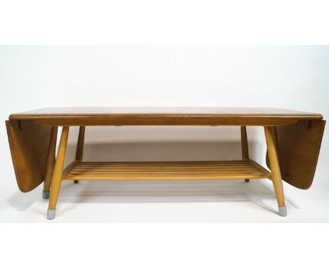 An Ercol light elm drop-leaf low coffee table, of rectangular form, with lower tier on splayed legs, 37cm high x 45.5cm wide 