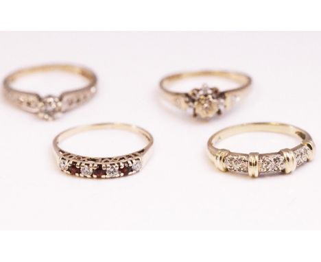 A collection of four dress rings to include: An illusion set fancy diamond band; A single stone diamond ring with stone shoul