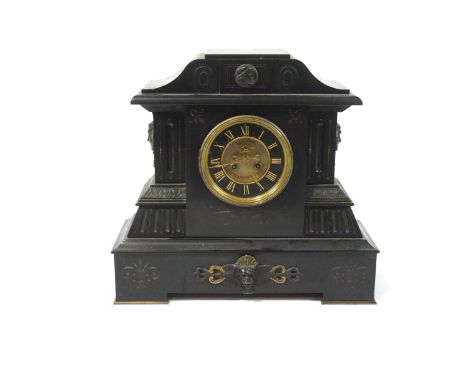 A continental slate and metal mounted clock,the scrolled pediment above a brass and black enamel dial with Roman numerals, th