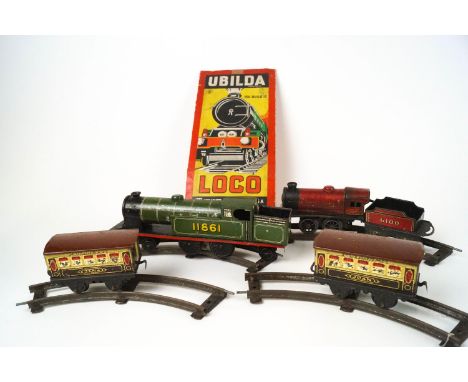 An Ubilda vintage train set, comprising a locomotive , carriages and track, part boxed 
