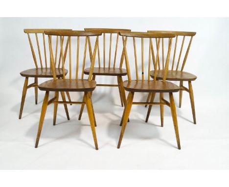 A set of five Ercol beech and elm stick back chairs, 79cm high x 41cm wide