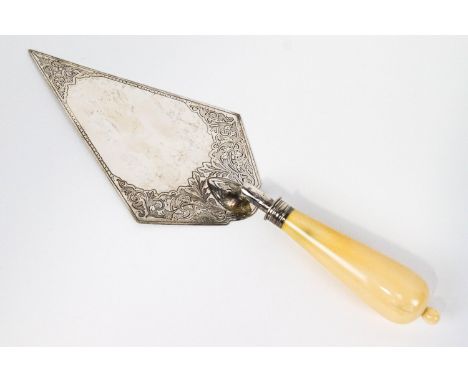 A silver and ivory presentation trowel, of usual form, the blade decorated with scroll work, London 1859, 35cm long, 233 gram