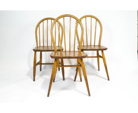 Three Ercol elm and beech dining chairs with Windsor style stick backs, 85cm high x 39.5cm wide