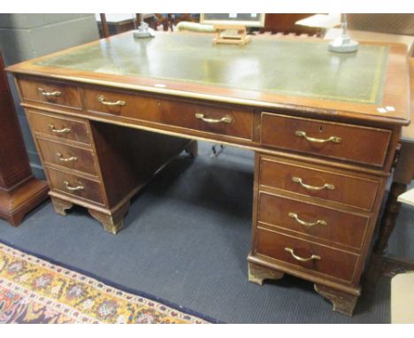 A reproduction mahogany pedestal desk on bracket feet, 79 x 151 x 90cm  