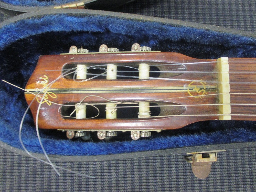 A Japanese made classical guitar in case in Cheffins Fine Art