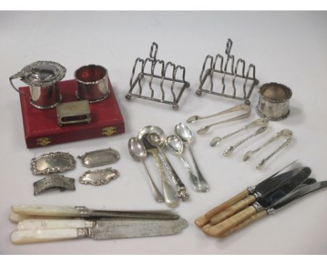 A collection of silver items including toast racks, napkin rings, decanter labels, flatware etc, apx 16.5ozt weighable  