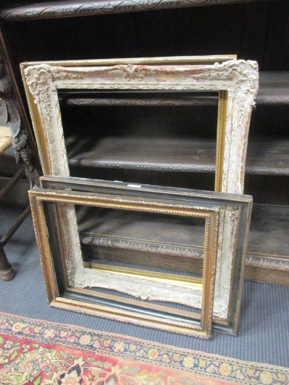 An 18th Century carved giltwood picture frame with beaded decoration