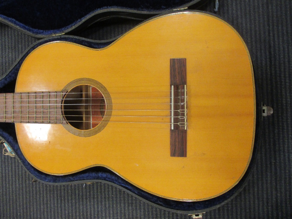 A Japanese made classical guitar in case in Cheffins Fine Art