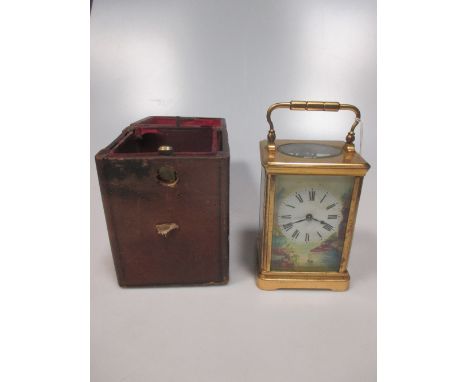 A French carriage clock, typical shape case, dial (cracked) painted with a lake scene, gong striking movement  