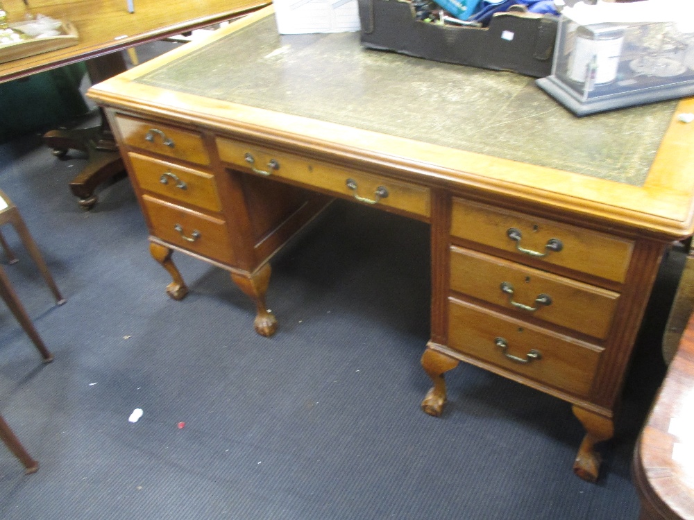 A faded mahogany pedestal partners desk, on cabriole legs, 80 x 152 x